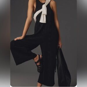 Chic Black Jumpsuit. Sporty ties on side of legs.